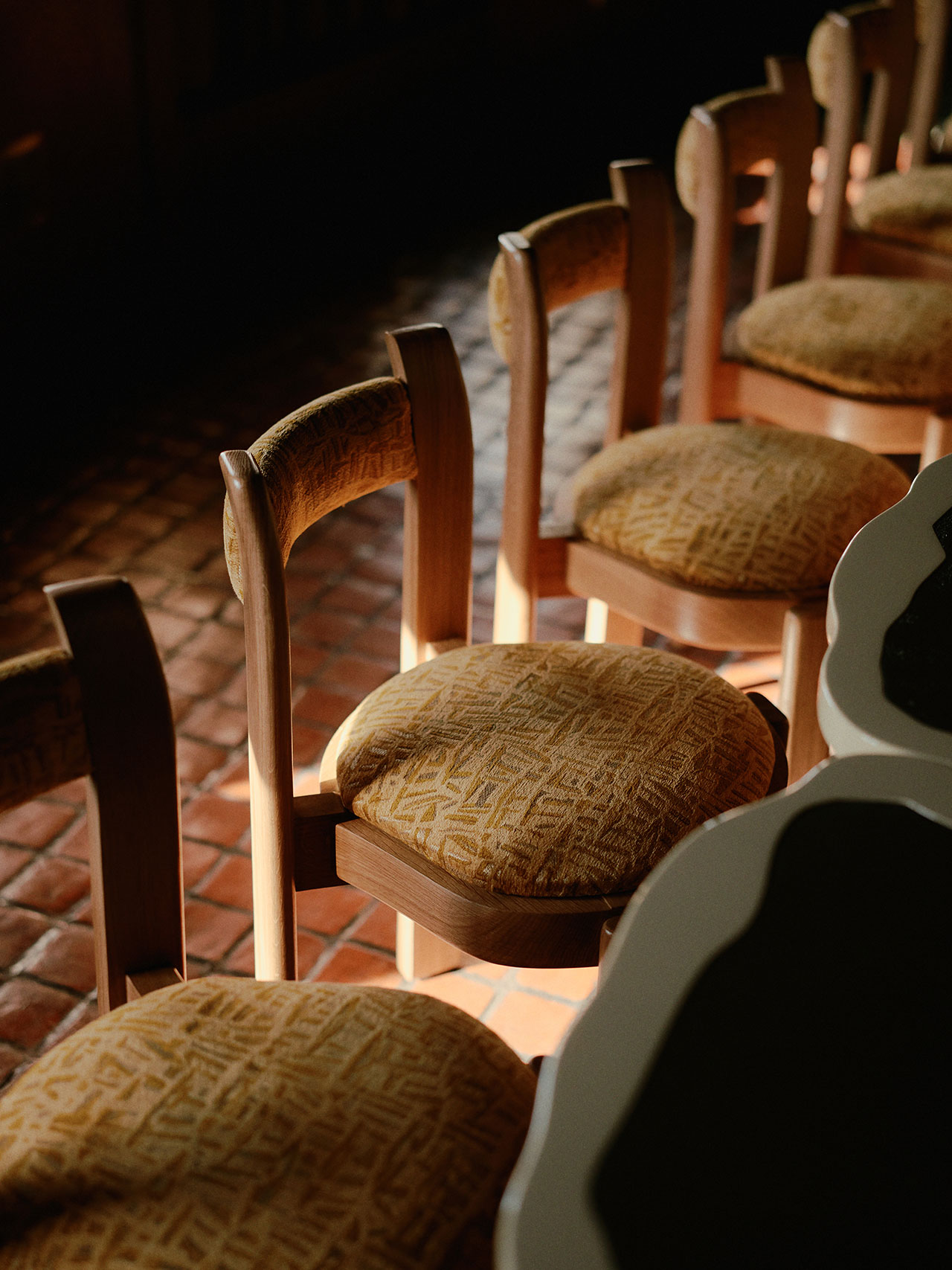 Bespoke oak chairs designed by Hugo Toro and crafted by Atelier Boutin with Pierre Frey fabric. Photography by William Jess Laird.