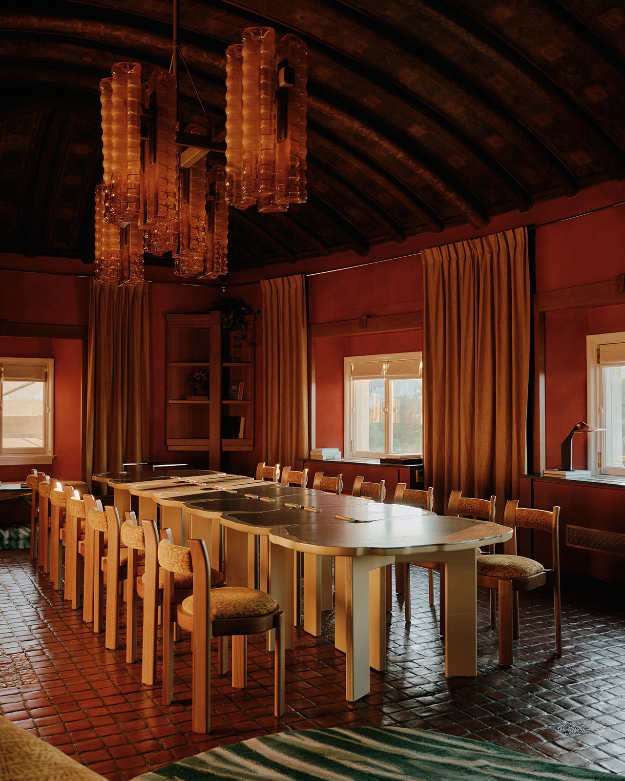Bespoke tables and chairs designed by Hugo Toro and crafted by Atelier Boutin. Bespoke hand blown glass chandelier designed by Hugo Toro and crafted by LightDrops. Photography by William Jess Laird.